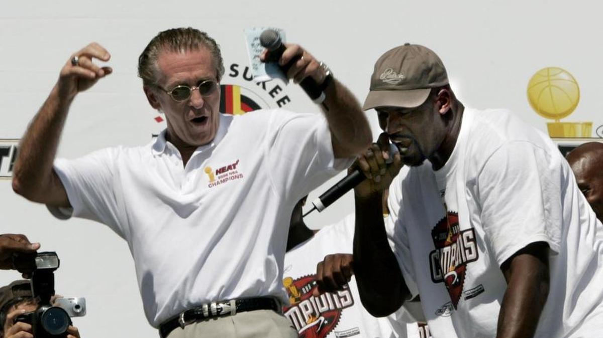 Pat Riley and Shaquille O’Neal do a rap and a dance during Miami Heat championship parade festivities on Fri., June 23, 2006. For Riley and Heat fans, the good old days seem longer and longer ago.