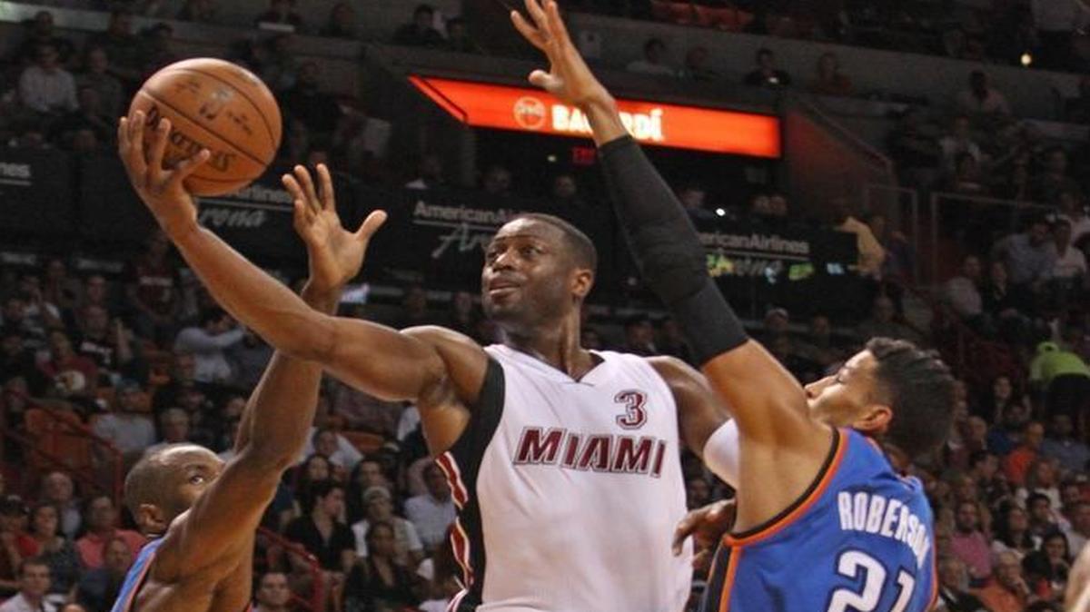 Dwyane Wade of the Miami Heat drives to the basket in the third quarter against the Oklahoma City Thunder on Thursday, Dec. 3, 2015 at AmericanAirlines Arena in Miami.
