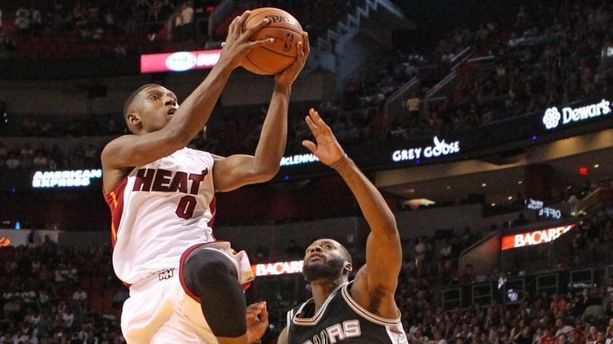 
Josh Richardson of the Miami Heat goes to the basket against Jonathon Simmons of the San Antonio Spurs in the fourth quarter of a preseason game on Monday, October 12, 2015 at the AmericanAirlines Arena in Miami.
