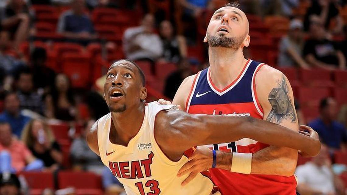 Bam Adebayo of the Miami Heat boxes out Marcin Gortat of the Washington Wizards during a preseason game at American Airlines Arena on October 11, 2017 in Miami, Florida.