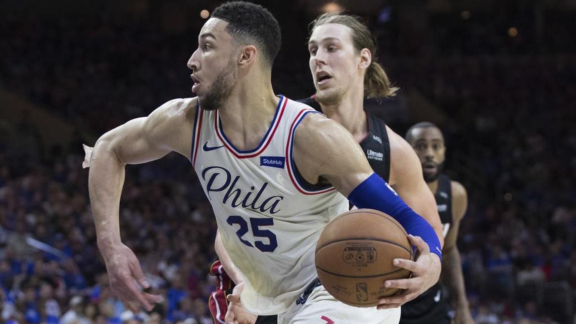 Philadelphia 76ers' Ben Simmons, left, of Australia, drives to the basket past Miami Heat's Kelly Olynyk, right, during the second half in Game 1 of a first-round NBA basketball playoff series, Saturday, April 14, 2018, in Philadelphia.