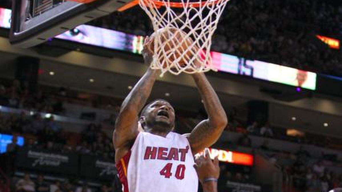 
Miami Heat forward Udonis Haslem goes to the basket against Minnesota Timberwolves center Nikola Pekovic, left, and teammate Thaddeus Young during the first quarter of an NBA basketball game at the AmericanAirlines Arena in Miami on Saturday, November 8, 2014.
