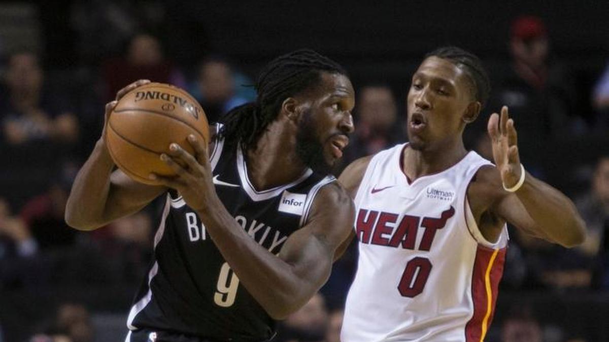 Brooklyn Nets' DeMarre Carroll, drives with the ball as Miami Heat's Josh Richardson defends during the first quarter of an NBA basketball game in Mexico City, Saturday, Dec. 9, 2017.