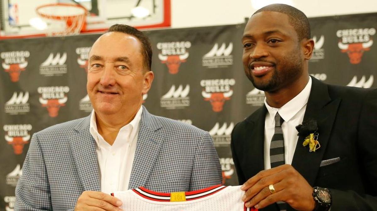 Chicago Bulls general manager Gar Forman, left, and Dwyane Wade hold a uniform during a news conference Friday, July 29, 2016, in Chicago. Wade who played at Miami Heat for 13 years, joined his hometown team for a two-year contract worth about $47 million.