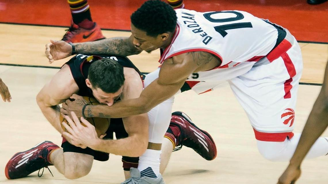 Toronto Raptors guard DeMar DeRozan (10) fouls Miami Heat guard Goran Dragic (7) during the second half in Game 1 of a second-round NBA basketball playoff series, Tues., May 3, 2016 in Toronto.