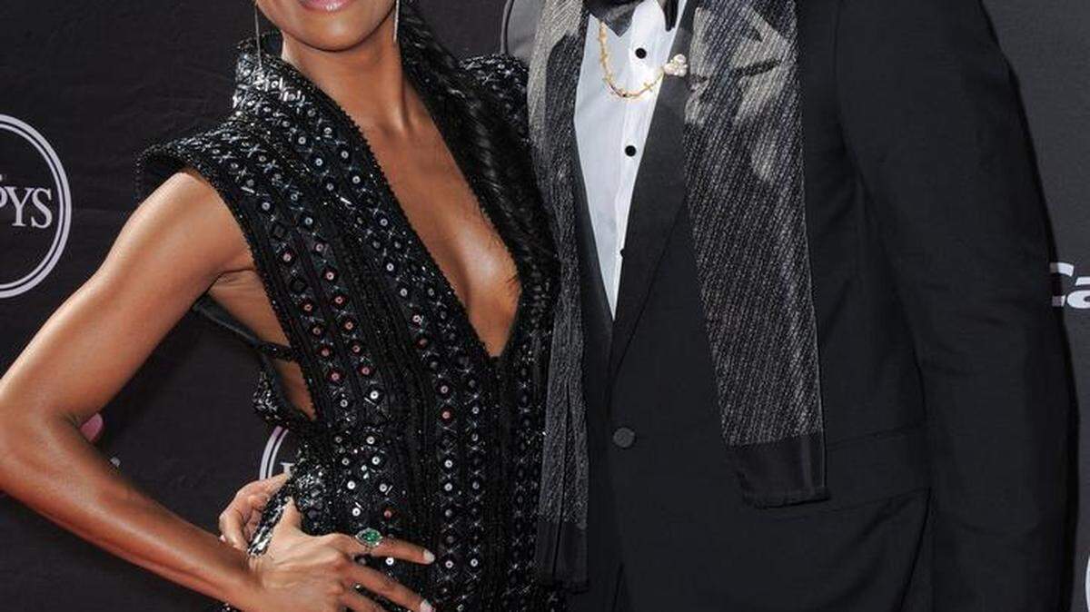 In this July 17, 2013, Actress Gabrielle Union, left, and Miami Heat's Dwyane Wade arrive at the ESPY Awards in Los Angeles. The Miami Heat star says while he always was a fan of fine dressing, it wasn’t until the former commissioner of the league instituted a dress code that he started taking more interest in what he would wear off the court. Now Wade is considered among the more fashion-forward stars in a league where players dress to impress.