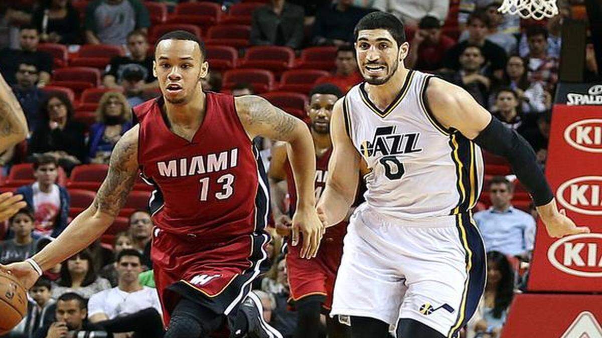 
Miami Heat guard Shabazz Napier drives to the basket chased by Utah"s Enes Kanter (0) in the fourth quarter of an NBA game at AmericanAirlines Arena in Miami on Wednesday, Dec. 17, 2014.
