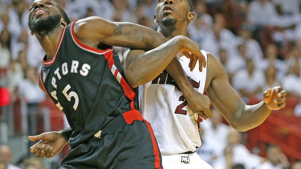 Miami Heat forward Joe Johnson and Toronto Raptors forward DeMarre Carroll tangle for a rebound. Johnson has found other ways to make a difference while struggling with his shot.