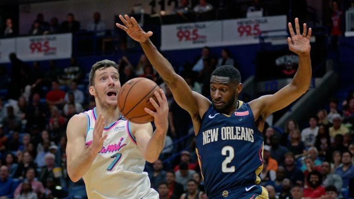 Miami Heat guard Goran Dragic (7) drives to the basket against New Orleans Pelicans guard Ian Clark (2) in the first half of an NBA basketball game in New Orleans on Friday, Feb. 23, 2018.