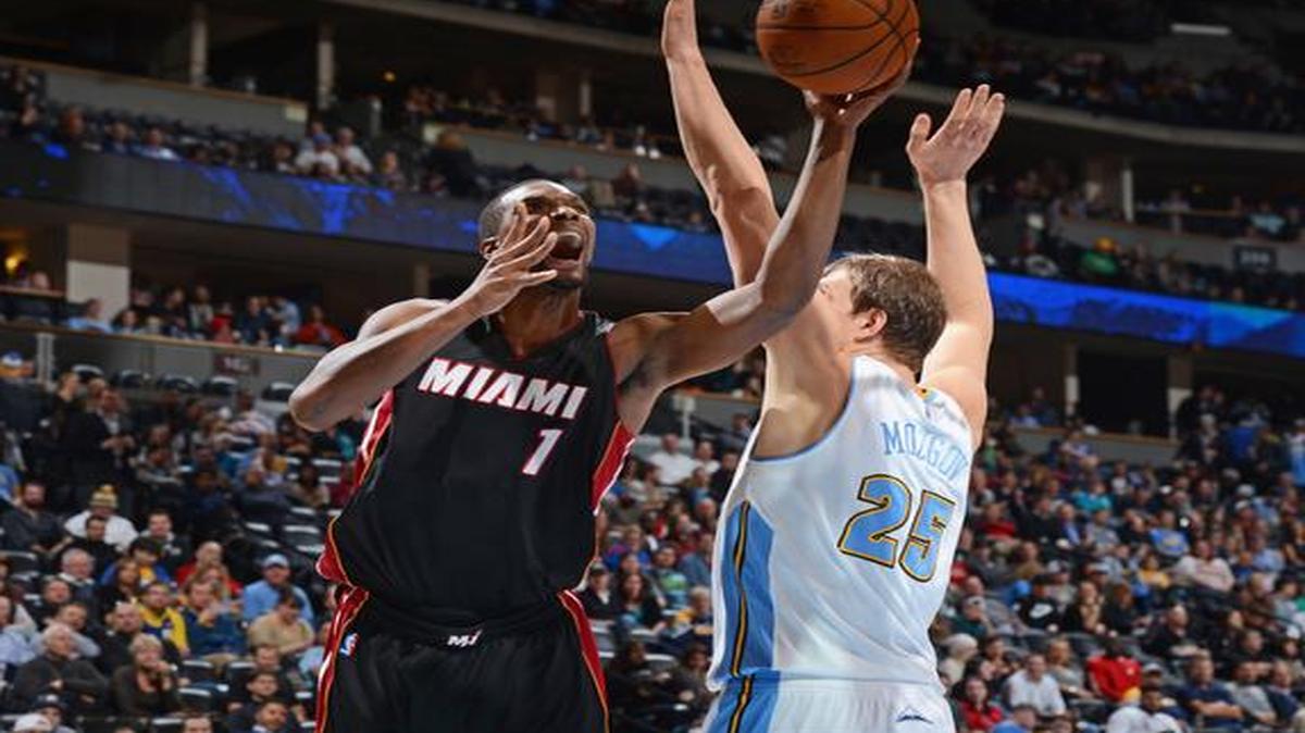 
 Chris Bosh #1 of the Miami Heat shoots the ball against the Denver Nuggets during the game on December 10, 2014 at the Pepsi Center in Denver, Colorado. 
