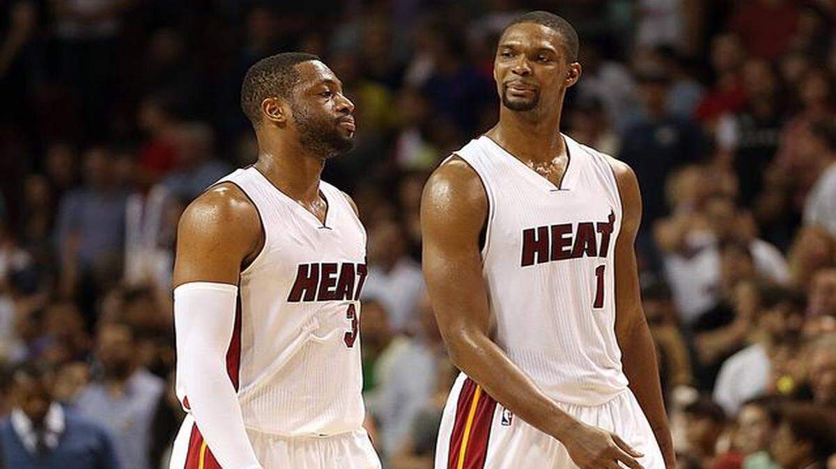 
Dwyane Wade and Chris Bosh react late in the fourth quarter of the Miami Heat's game against the Orlando Magic at AmericanAirlines Arena in Miami on Monday, Dec. 29, 2014.
