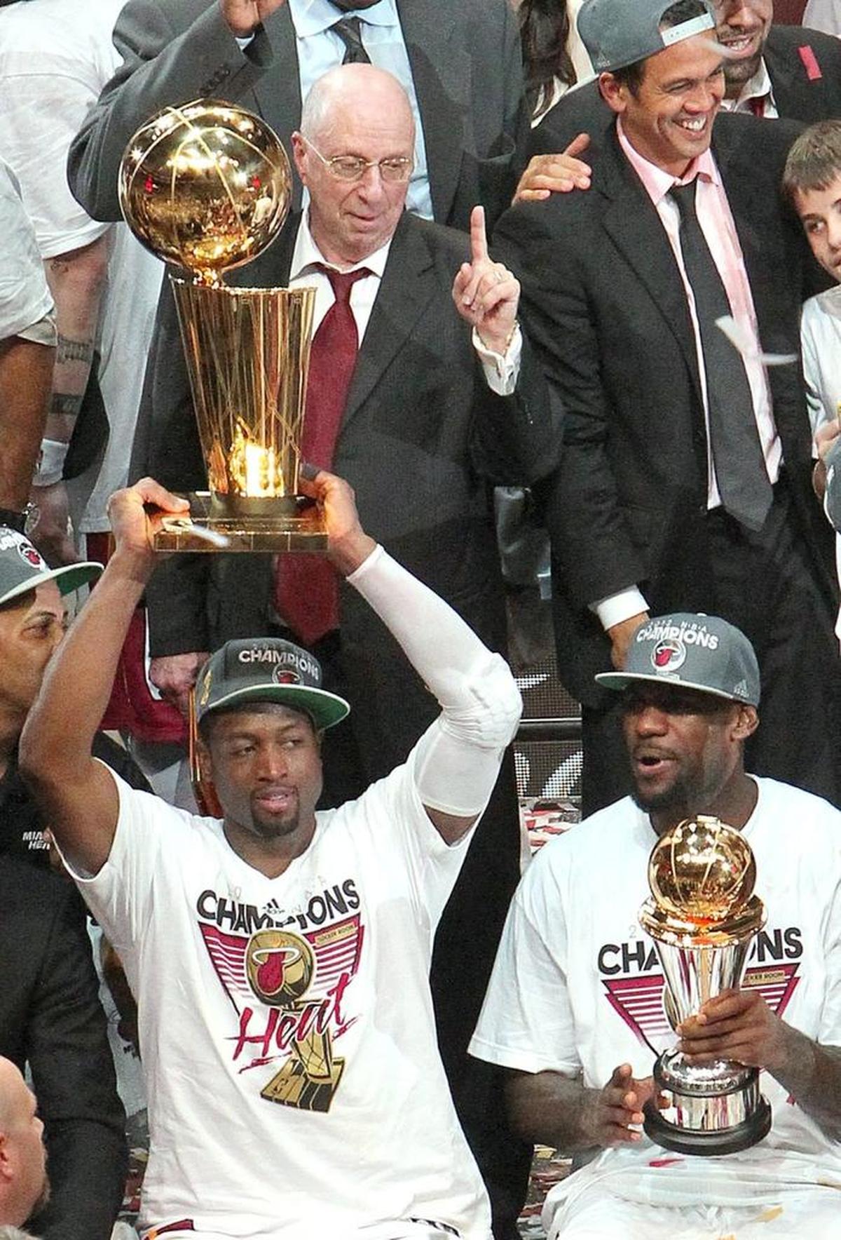 Miami’s Dwyane Wade celebrates with LeBron James after the Heat defeated Oklahoma City 121-106 in Game 5 of the NBA Finals at AmericanAirlines Arena on June 21, 2012.