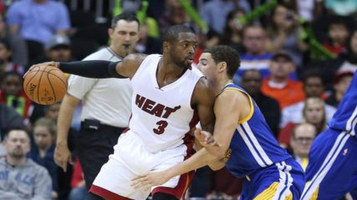 
Preseason form: Dwyane Wade looks for an opening for a pass or shot against the Golden State Warriors on Friday in Kansas City, Missouri. 
