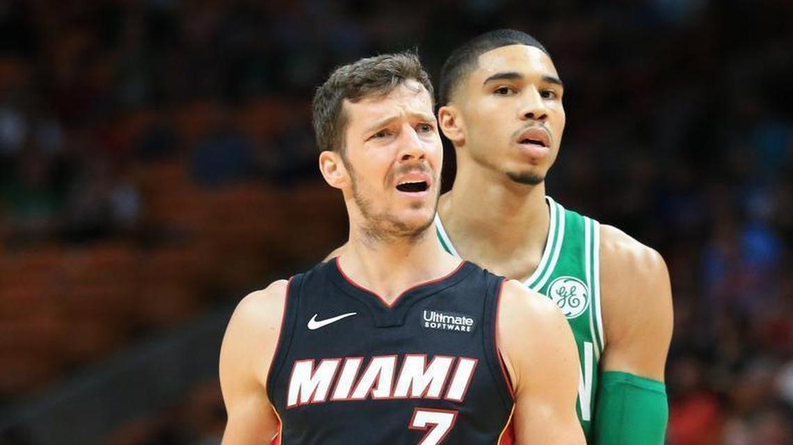 Miami Heat guard Goran Dragic gestures towards the official after a call in the first quarter as Boston Celtics forward Jayson Tatum walks behind him at AmericanAirlines Arena on Saturday, Oct. 28, 2017.