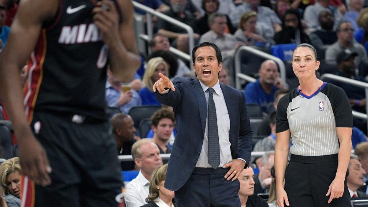Miami Heat head coach Erik Spoelstra, center, calls out instructions after talking with official Lauren Holtkamp, right, during the second half of an NBA basketball game against the Orlando Magic Wednesday, Oct. 18, 2017, in Orlando, Fla. The Magic won 116-109.
