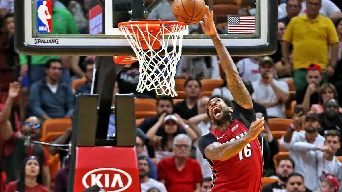 Miami Heat forward James Johnson scores a big basket at the end of the first overtime in a win over the Denver Nuggets at AmericanAirlines Arena in Miami, Florida, March 19, 2018.