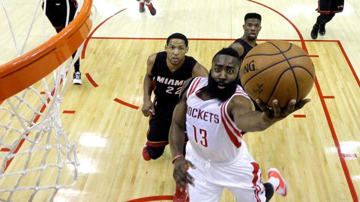 
Houston Rockets' James Harden (13) goes up for a shot as Miami Heat's Danny Granger (22) defends during the first half of an NBA basketball game Saturday, Jan. 3, 2015, in Houston. 
