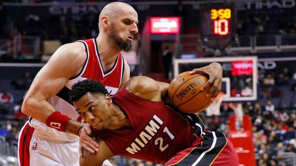 Miami Heat center Hassan Whiteside drives against Washington Wizards center Marcin Gortat during the first half Wednesday, Jan. 20, 2016, in Washington.
