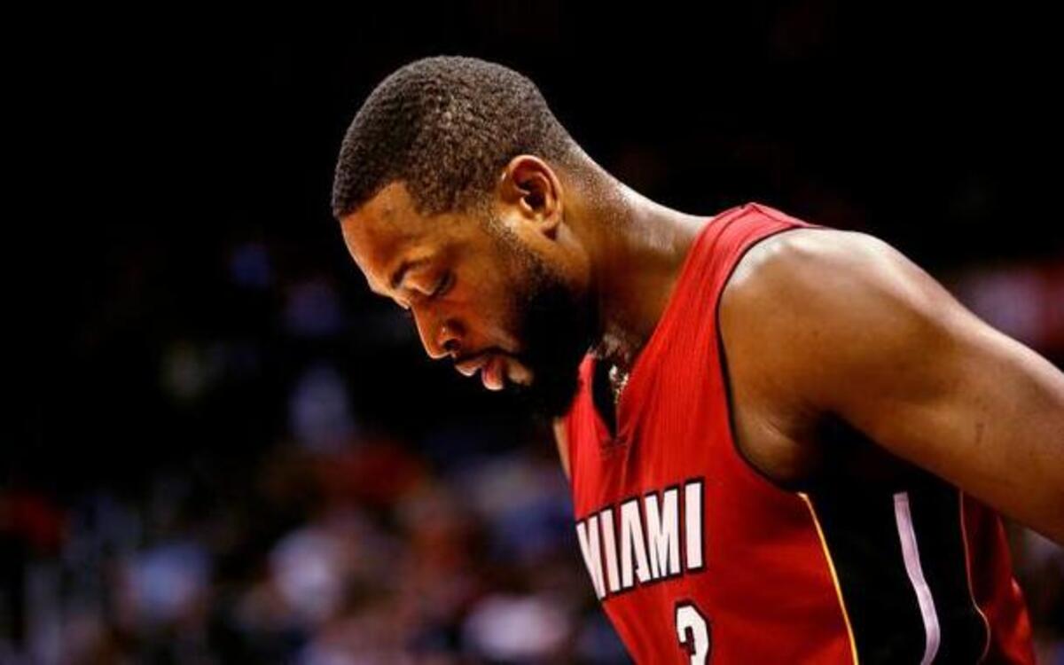 
Tough it out: Dwyane Wade said he would like to have fluid drained from his left knee, but the Heat might not be able to withstand an absence from him. 
