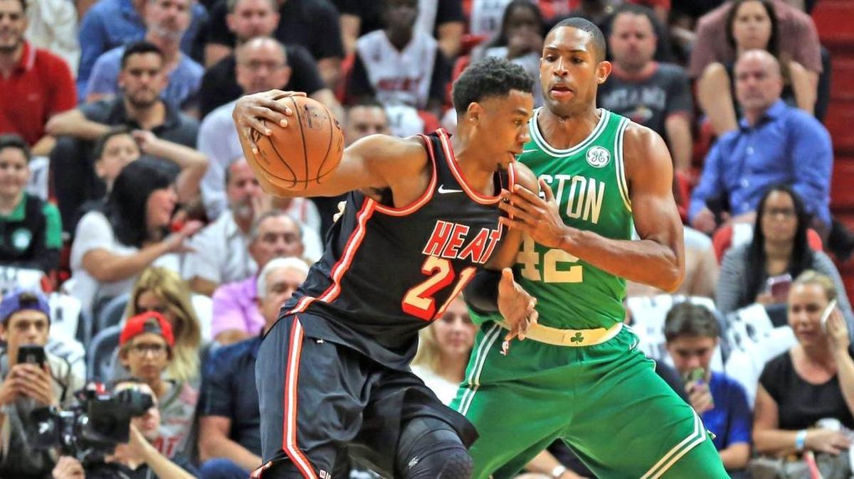 Miami Heat center Hassan Whiteside (21) goes up against Boston Celtics forward Al Horford (42) in the first quarter as the Miami Heat host the Boston Celtics at the AmericanAirlines Arena on Wednesday, Nov. 22, 2017.