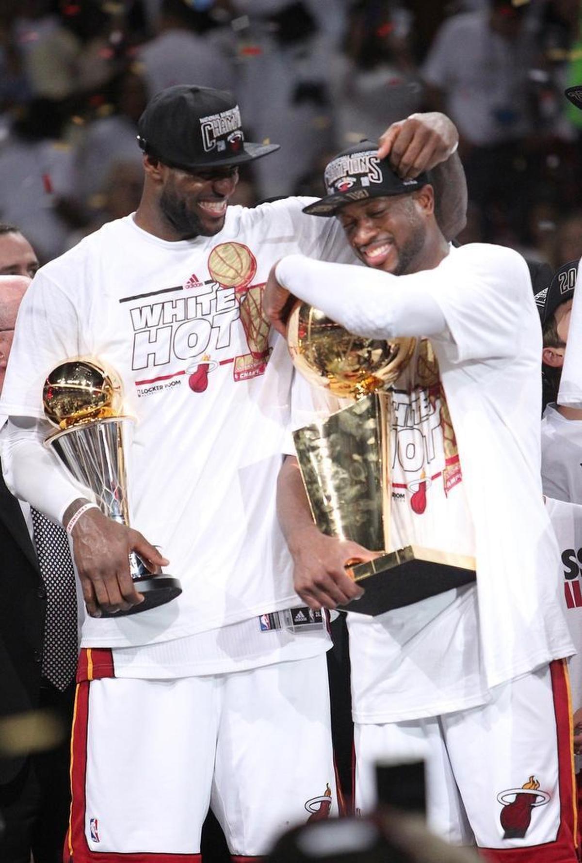 LeBron James and Dwyane Wade celebrate after the Heat won Game 7 of the 2013 NBA Finals at AmericanAirlines Arena in Miami, Florida on Thursday, June 20, 2013.