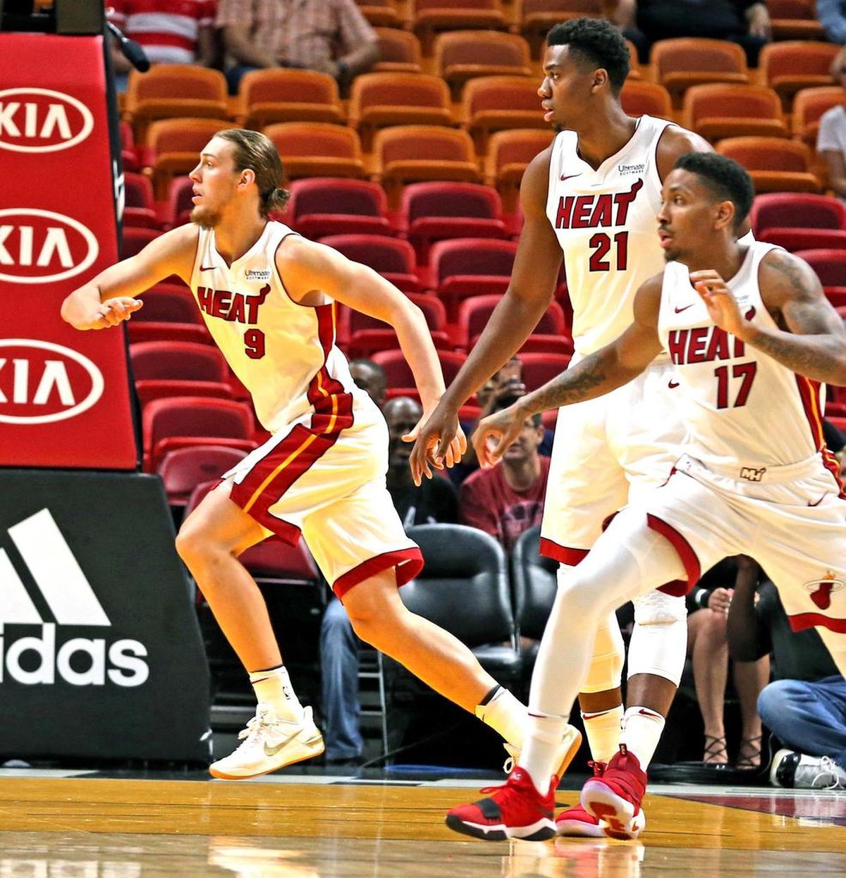Miami Heat forward Kelly Olynyk, Hassan Whiteside and Rodney McGruder watch the ball in the first quarter as they play the Charlotte Hornets at the AmericanAirlines Arena in Miami, Florida, October 9, 2017.