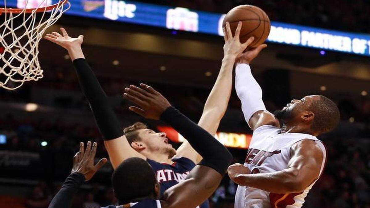 
Dwyane Wade has his shot blocked by Mike Muscala in the first quarter of the Miami Heat’s game against the Atlanta Hawks at AmericanAirlines Arena in Miami on Saturday, February 28, 2015.
