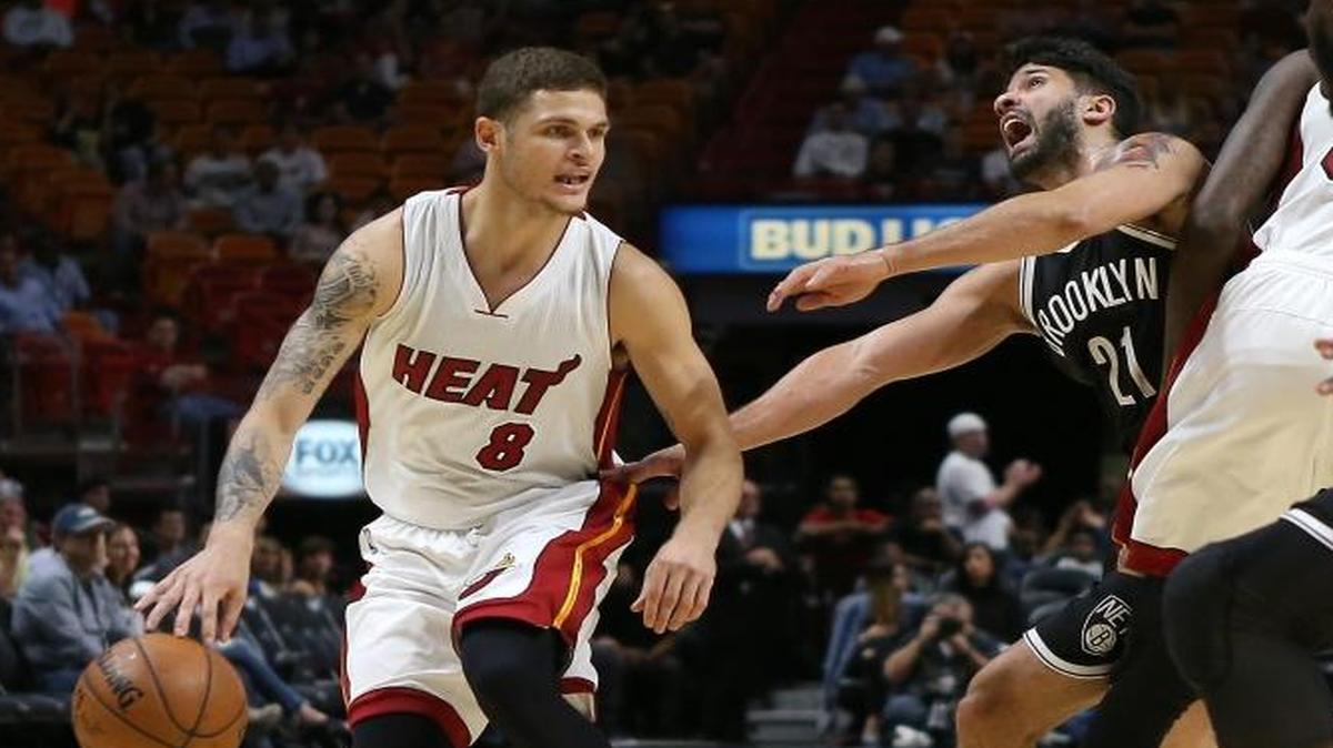 Miami Heat guard Tyler Johnson drives against the Brooklyn Nets Greivis Vasquez,21, in the first quarter of an preseason NBA basketball game at American Airlines Arena on Tuesday, Oct. 11, 2016, in Miami.