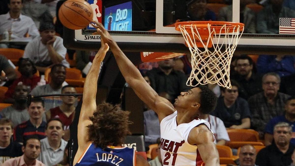 Hassan Whiteside of the Miami Heat blocks Robin Lopez of the New York Knicks in the first quarter on Monday, November 23, 2015 at AmericanAirlines Arena.