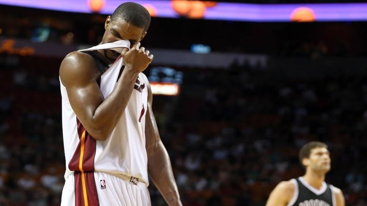 Chris Bosh of the Miami Heat reacts as the Brooklyn Nets increase their lead in the fourth quarter at AmericanAirlines Arena in Miami on Monday, December 28, 2015.
