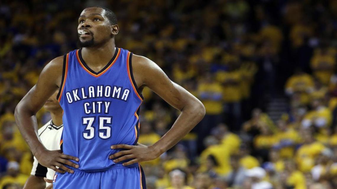 FILE - In this May 26, 2016, file photo, Oklahoma City Thunder's Kevin Durant watches during the closing minutes of the second half in Game 5 of the NBA basketball Western Conference finals against the Golden State Warriors in Oakland, Calif. Durant and others are ready to decide their NBA futures, with free agency beginning Friday, July 1, 2016. Teams have more cap room than ever, meaning this could be one of the more highly anticipated periods in league history.