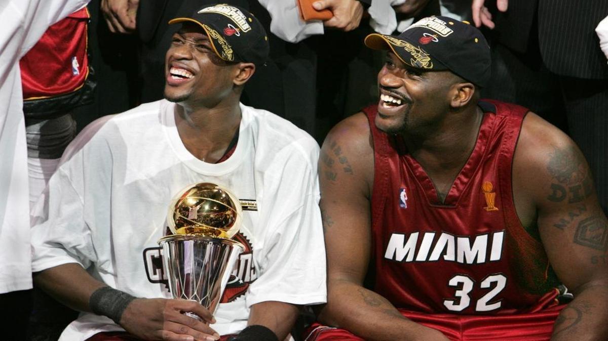 Miami Heat players Dwyane Wade and Shaquille O’Neal celebrate the team’s first championship after winning Game 6 of the NBA Finals against the Dallas Mavericks on June 20, 2006 at the American Airlines Center in Dallas.