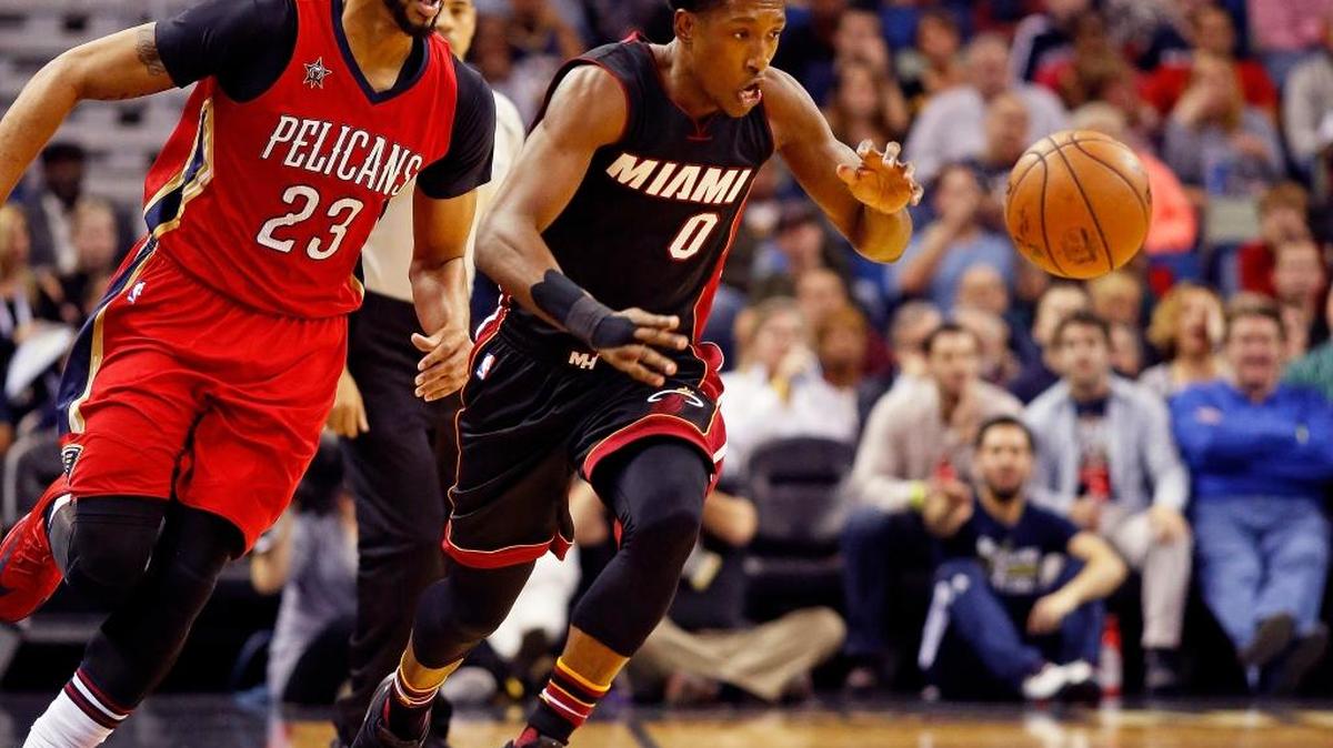 New Orleans Pelicans forward Anthony Davis (23) chases Miami Heat guard Josh Richardson (0) in the first half of an NBA basketball game in New Orleans, Friday, Dec. 23, 2016.