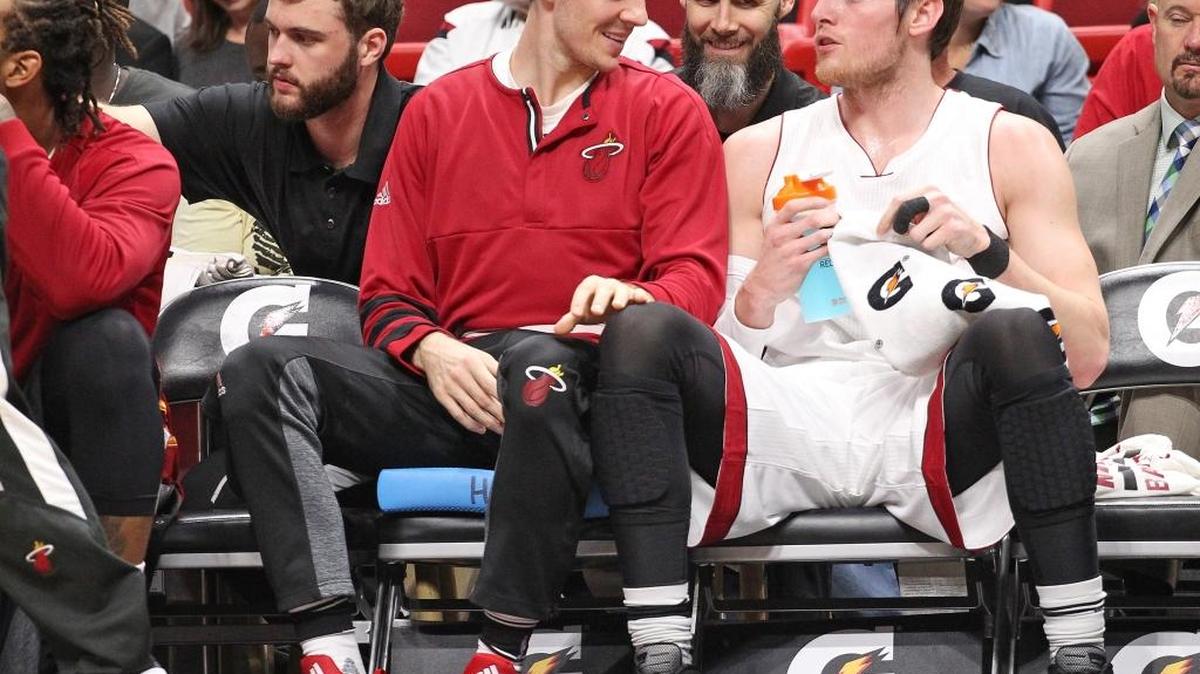 Goran Dragic, left, talks with teammate while he sat the bench during the Heat vs Detroit game inside the American Airlines Arena on Sunday, January 1, 2017.