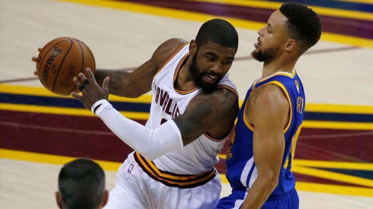 Cleveland guard Kyrie Irving is guarded by Golden State’s Stephen Curry during Game 3 of the 2017 NBA Finals on June 7.