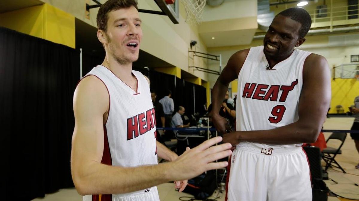 Miami Heat's Goran Dragic, left, and Luol Deng (9) talk during Media Day on Monday, Sept. 28, 2015, in Miami.