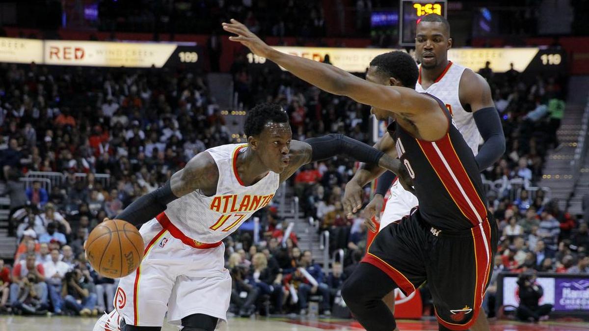 Atlanta Hawks guard Dennis Schroeder (17) drives to the basket under Miami Heat guard Josh Richardson (0) during the first half Friday, Feb. 19, 2016, in Atlanta.