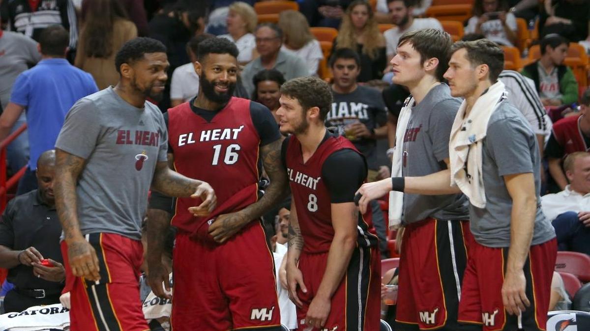 Miami Heat players Udonis Haslem, James Johnson, Tyler Johnson, Luke Babbitt and Goran Dragic react after a play during the fourth quarter of an NBA basketball game against the Cleveland Cavaliers at AmericanAirlines Arena in Miami on Sat., March 4, 2017.