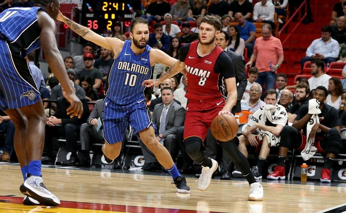 Miami Heat guard Tyler Johnson drives to the basket against Magic guard Evan Fournier in the second quarter of a game at AmericanAirlines Arena in Miami on Tuesday, December 26, 2017.