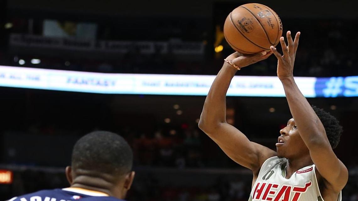 Miami Heat guard Josh Richardson shoots to the basket over Utah's forward Joe Johnson in the first quarter Saturday, Nov. 12, 2016.
