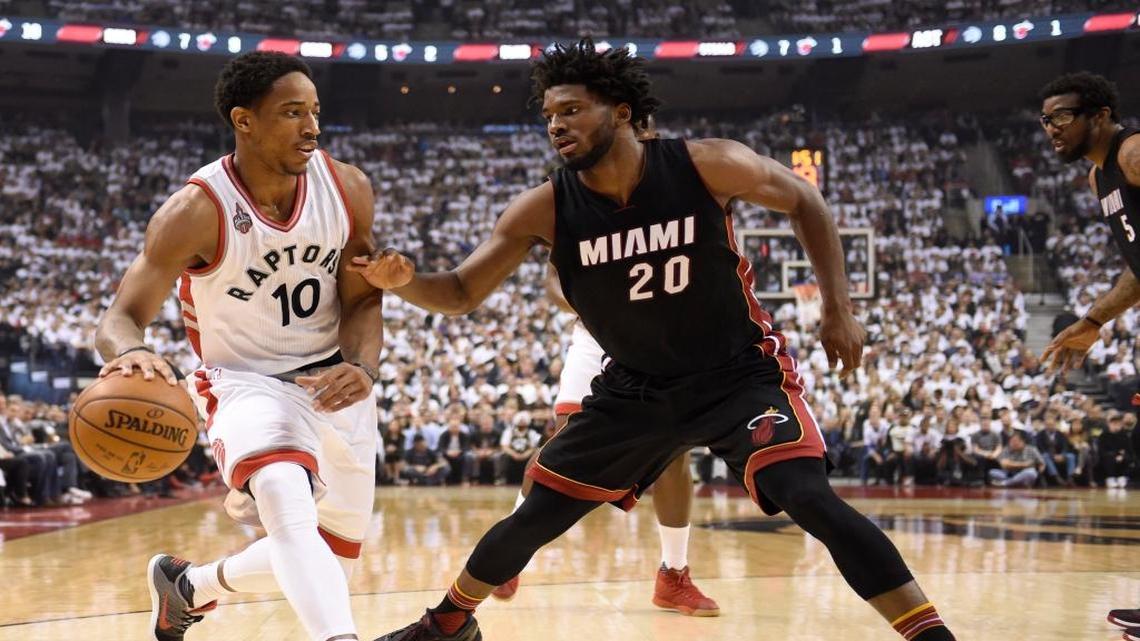 Toronto Raptors' DeMar DeRozan (10)controls the ball as Miami Heat's Justise Winslow (20) defends during first half NBA playoff basketball action in Toronto on Thursday, May 5, 2016.