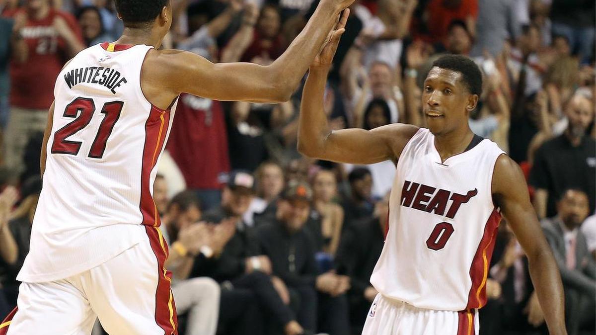 Heat Hassan Whiteside, left, gets a "high-five" from teammate Josh Richardson after scoring in the fourth q. On Thurs., April 7, 2016 the Miami Heat played against Chicago Bulls at the American Airlines Arena.