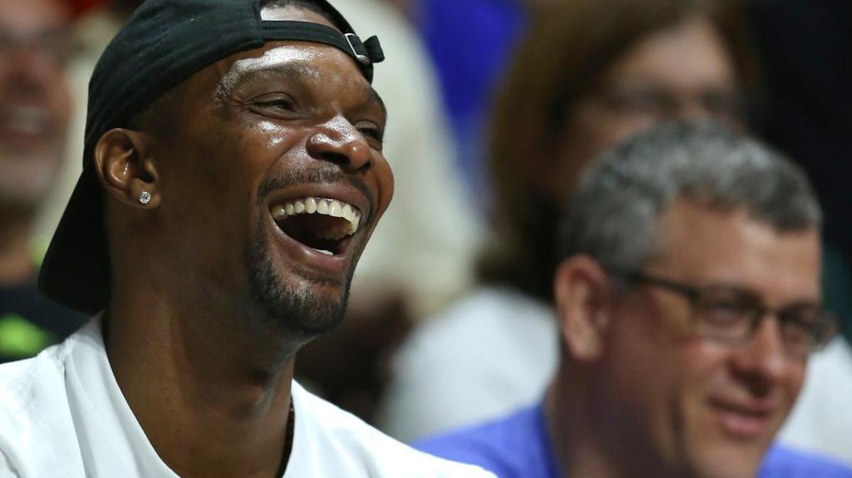 Chris Bosh enjoys the Miami Hurricanes’ game against Duke on Feb. 25., in Coral Gables.