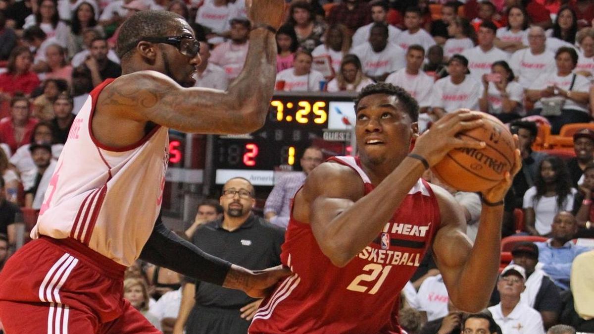 
Hassan Whiteside goes to the basket against Amar’e Stoudemire during the Heat’s Red, White & Pink Game.
