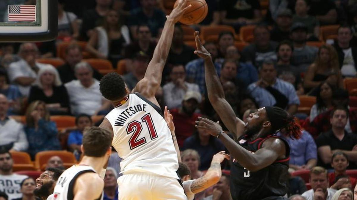 Miami Heat center Hassan Whiteside blocks a shot against Houston Rockets forward Montrezl Harrell during the second quarter of an NBA basketball game at AmericanAirlines Arena in Miami on Tues., Jan. 17, 2017.
