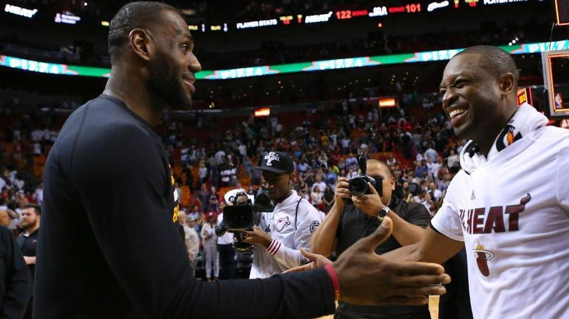 LeBron James, forward of the Cleveland Cavaliers, talks with Dwyane Wade, guard of the Miami Heat after an NBA basketball game at the AmericanAirlines Arena in Miami on Saturday, March 19, 2016.