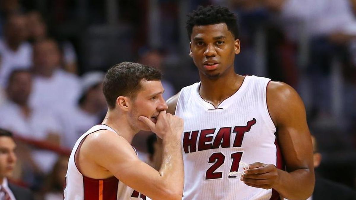 Miami Heat guard Goran Dragic talks with Hassan Whiteside during the second quarter of Game 7 of the first round of the 2016 NBA Eastern Conference Playoffs against the Charlotte Hornets at AmericanAirlines Arena in Miami on Sunday, May 1, 2016.