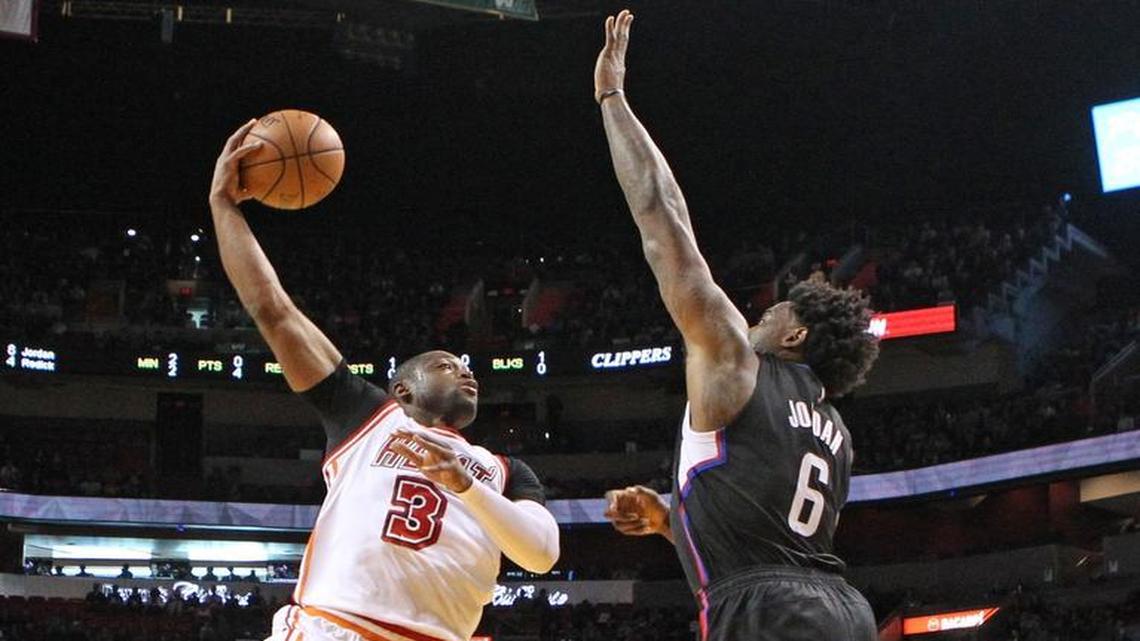 Dwyane Wade shoots over DeAndre Jordan in the first quarter of the Miami Heat’s game against the Los Angeles Clippers on Sunday, February 7, 2016 at AmericanAirlines Arena in Miami.