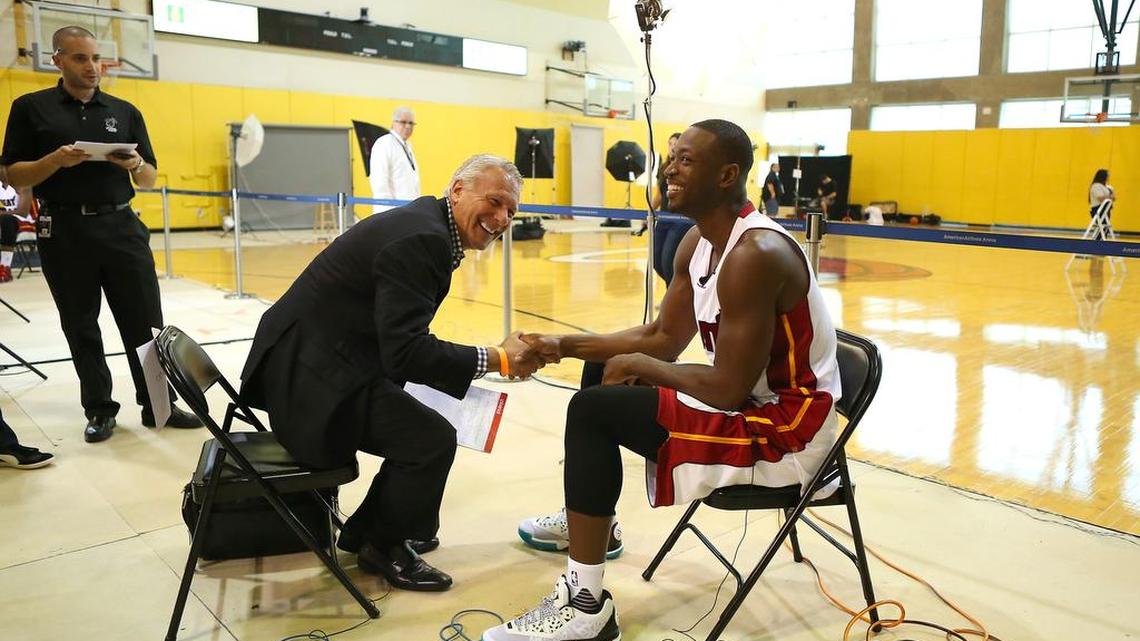 Miami Heat guard Dwyane Wade talks with WSVN-Ch. 7 anchor Steve Shapiro during the Media Day for the 2015-16 NBA season at AmericanAirlines Arena in Miami on Monday, September 28, 2015.