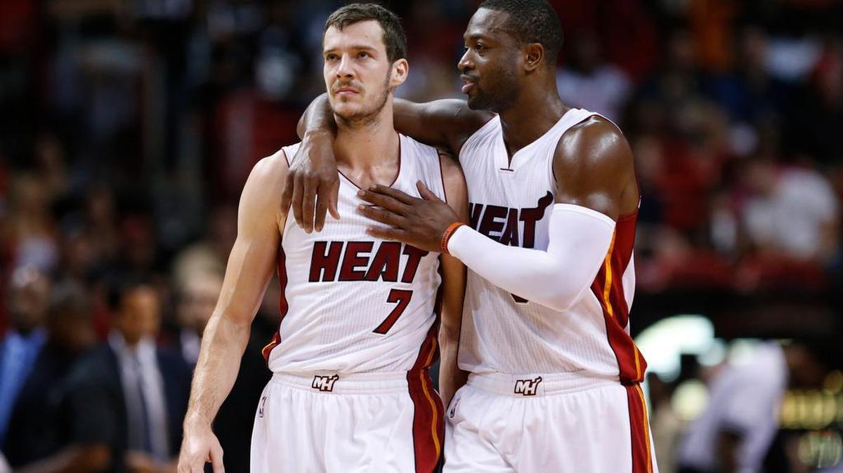Dwyane Wade, right, talking with Goran Dragic, said: ‘We’re doing OK for the first 15 [games.] We saw some good things. We saw some not-so-good things.’